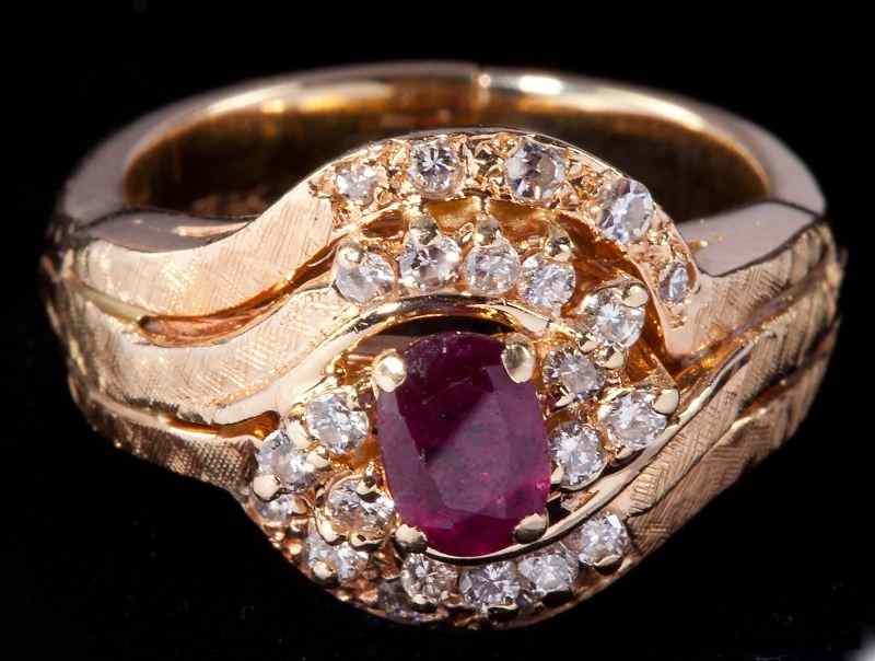 Appraisal: Ruby and Diamond Cocktail Ringcentering on a beautiful oval ruby