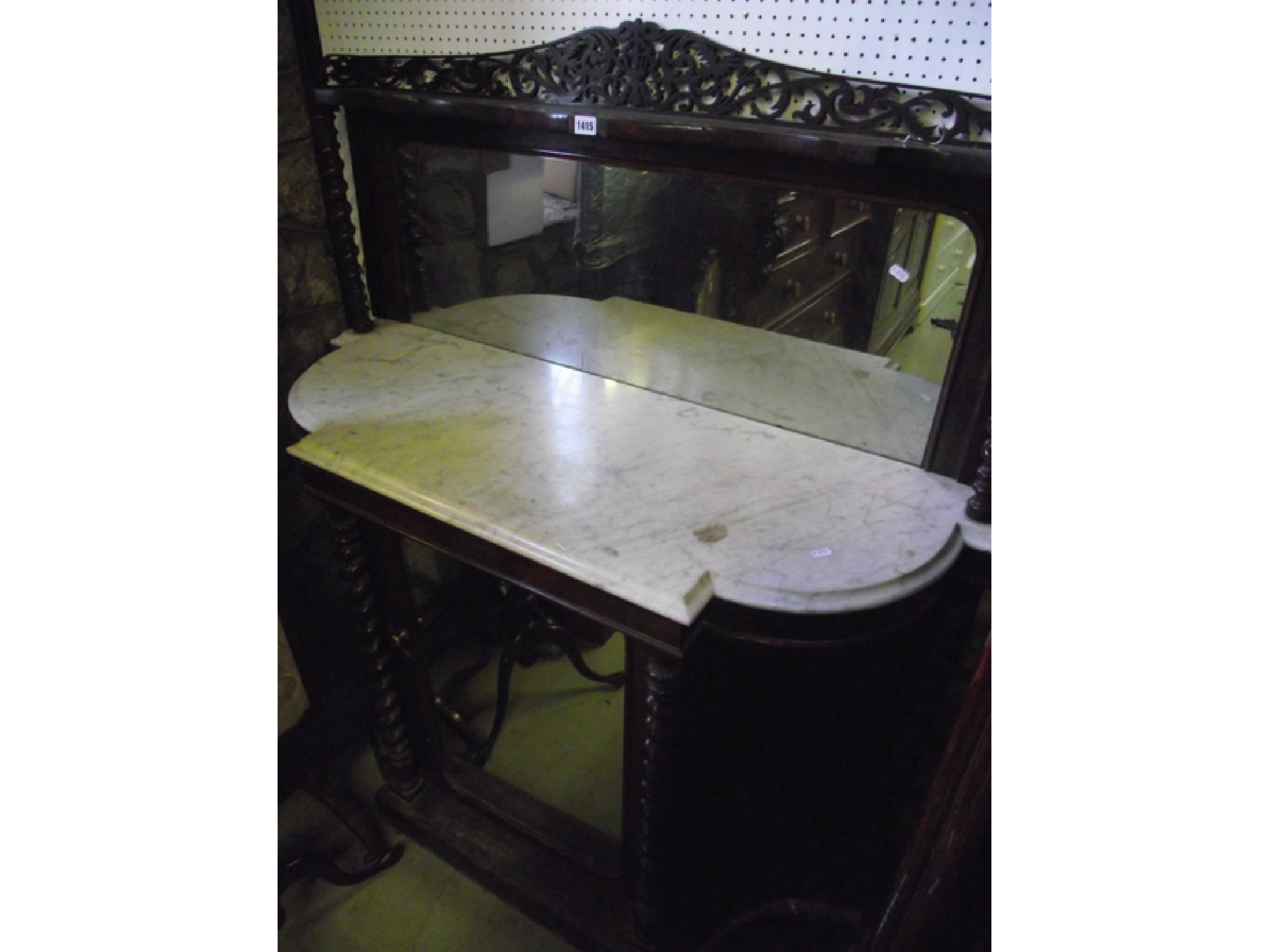 Appraisal: A Victorian rosewood chiffonier the base enclosed by a mirror