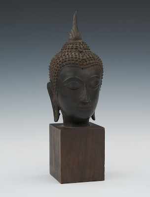 Appraisal: A Bronze Head of Buddha Traces of gilt over bronze