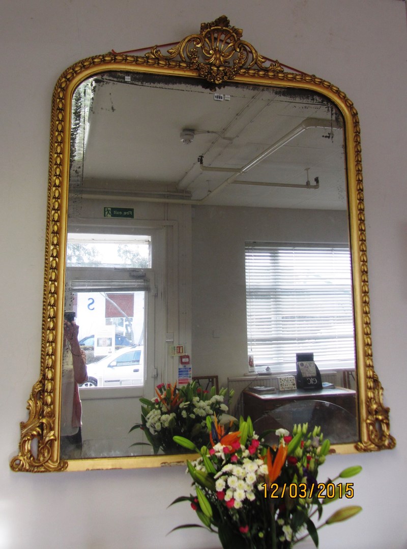 Appraisal: A th century gilt framed overmantel mirror with pierced shell