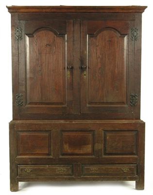 Appraisal: An th century oak press cupboard having a pair of