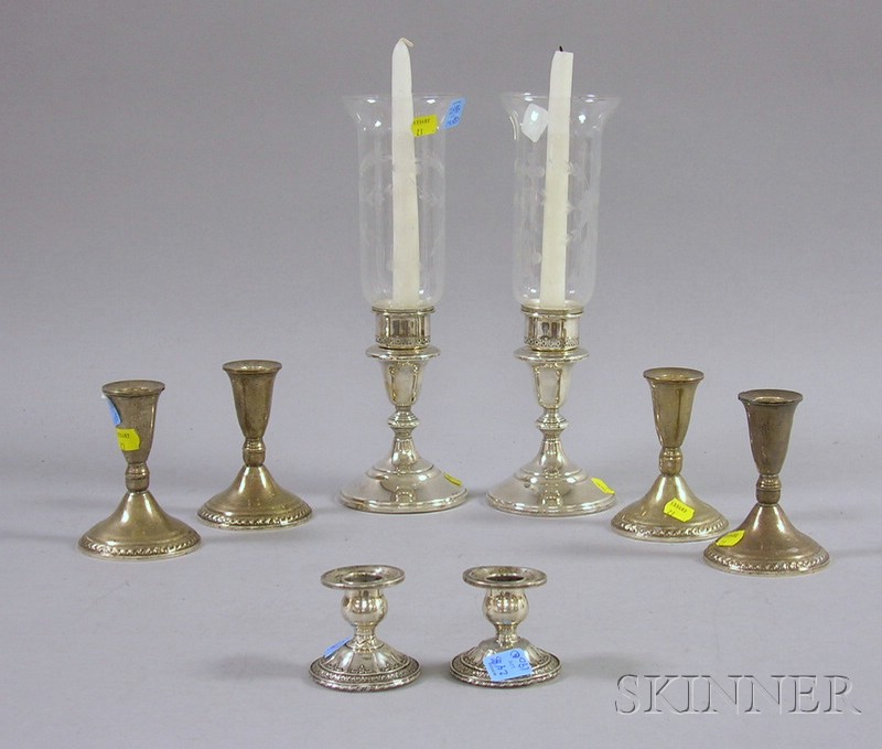 Appraisal: Eight Weighted Sterling Silver Candlesticks a set of four medium