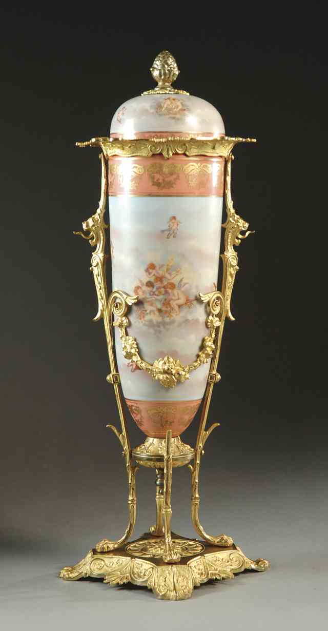 Appraisal: A FRENCH PORCELAIN COVERED URN the fitted original cover now