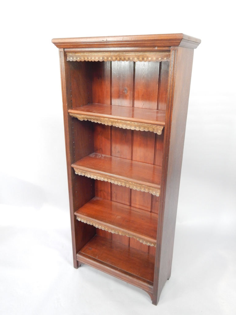 Appraisal: A mahogany open bookcase the outswept pediment over three shelves