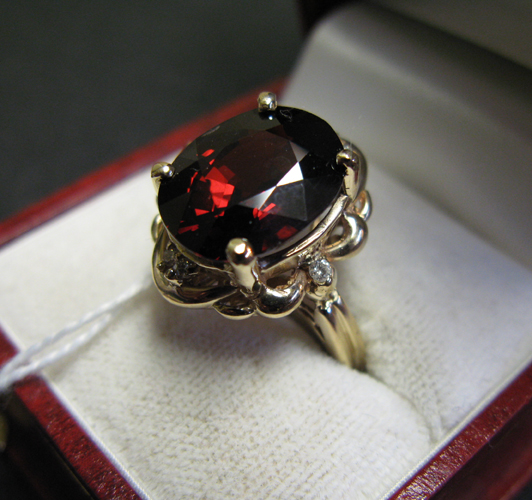 Appraisal: RHODOLITE GARNET DIAMOND AND FOURTEEN KARAT GOLD RING centered and