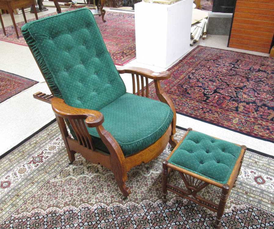 Appraisal: AN OAK 'MORRIS' ARMCHAIR WITH FOOTSTOOL American c with green