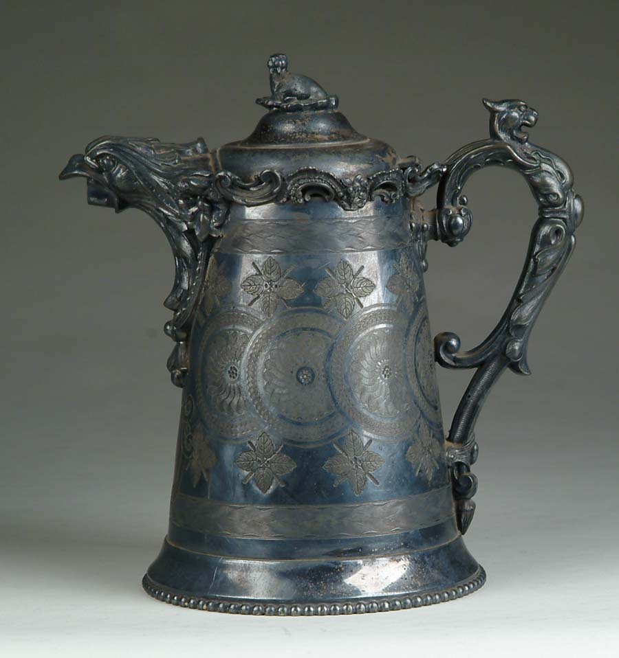 Appraisal: SIMILAR SILVER PITCHER W SAME DECORATIONS ON THE HANDLE SPOUT