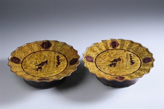 Appraisal: PAIR JAPANESE KUTANI PORCELAIN TAZZAS Meiji period Riverscape decoration scalloped