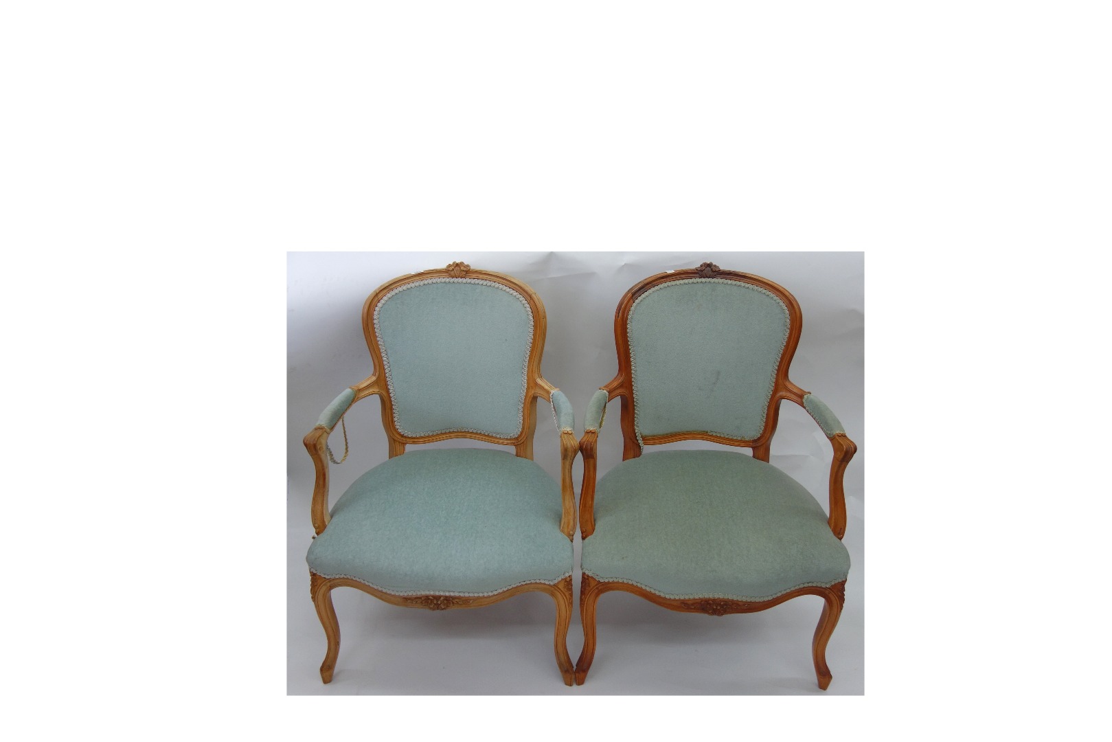 Appraisal: A pair of reproduction Louis XV style carved beech fauteuil