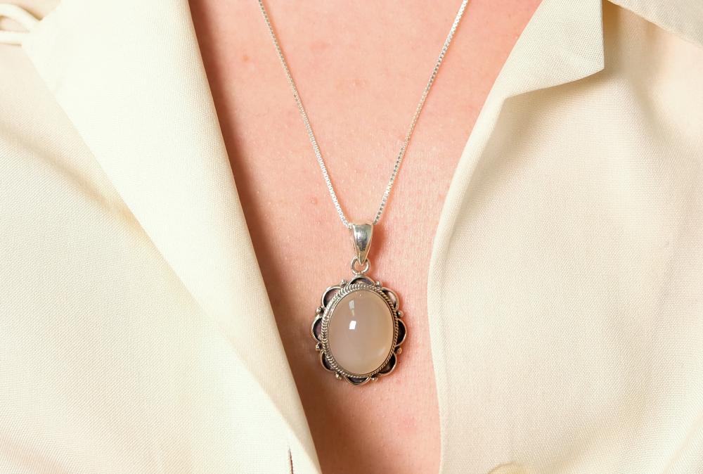 Appraisal: Sterling silver necklace hung with a oval Moonstone cabochon pendant