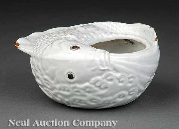 Appraisal: A Chinese White Glazed Porcelain Fish Form Brushwasher incised Qianlong