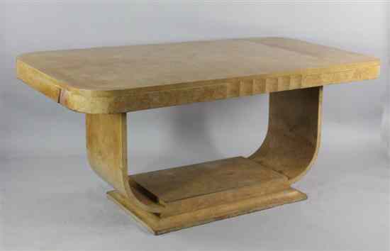 Appraisal: An Art Deco maple and walnut dining table with quartered