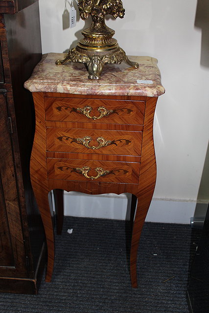 Appraisal: A PAIR OF FRENCH BEDSIDE TABLES with serpentine marble tops