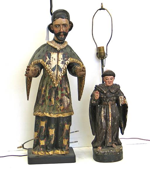 Appraisal: Two Spanish Colonial carved and polychrome decorated wood religious figures