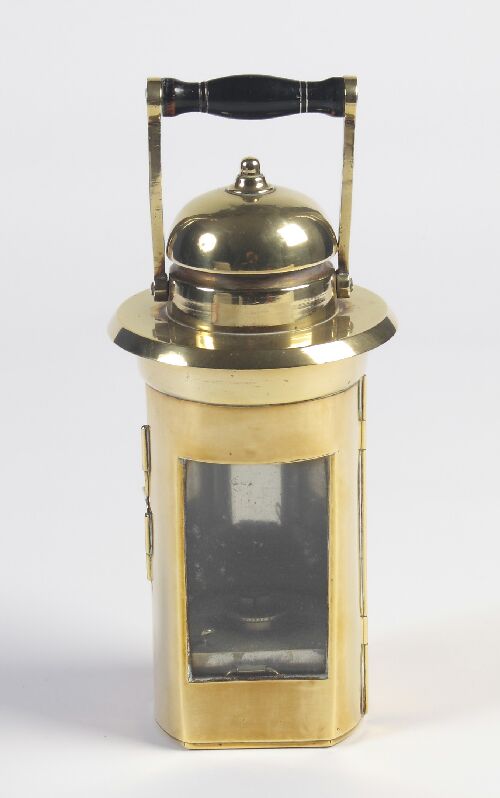 Appraisal: A brass paraffin hand held lantern the domed top with