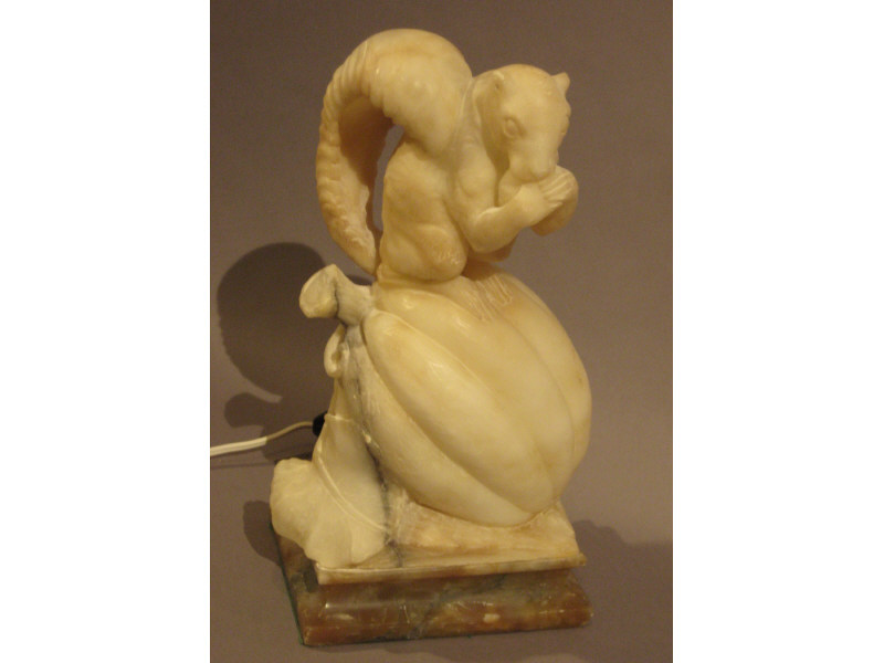 Appraisal: ITALIAN MARBLE FIGURAL LAMP Depicting a squirrel resting atop a