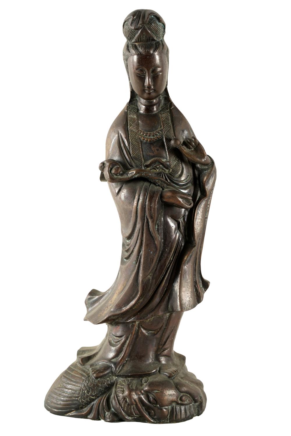 Appraisal: CHINESE BRONZE GUANYIN FIGUREon an integral base Condition rubbed wear