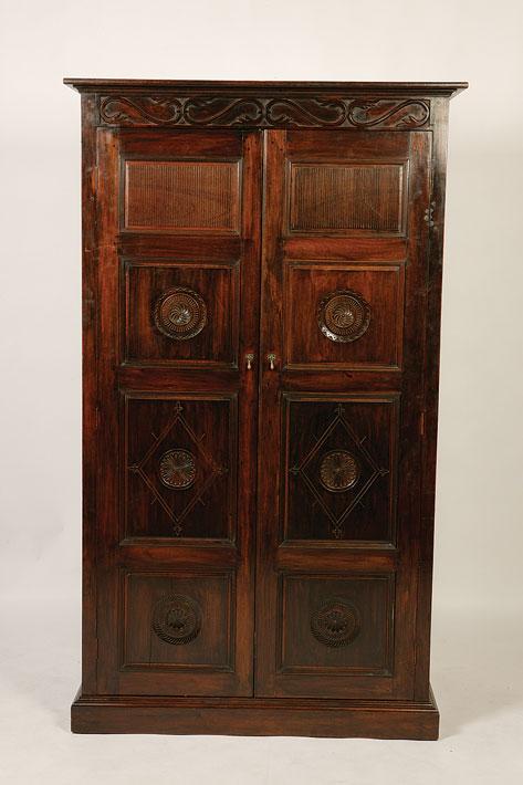 Appraisal: AN ANGLO-INDIAN ROSEWOOD WARDROBE with a carved cornice above two