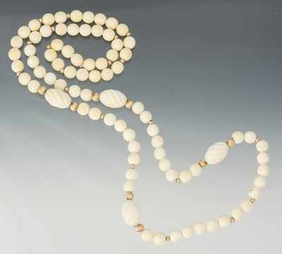 Appraisal: A Carved Ivory and Gold Bead Necklace Designed with round