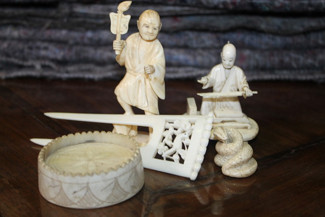 Appraisal: A JAPANESE IVORY NETSUKE in the form of a coiled