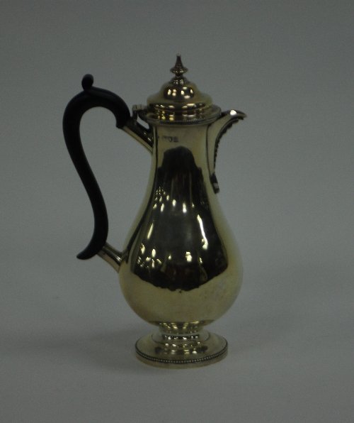 Appraisal: A silver hot water jug TB London of pear shape