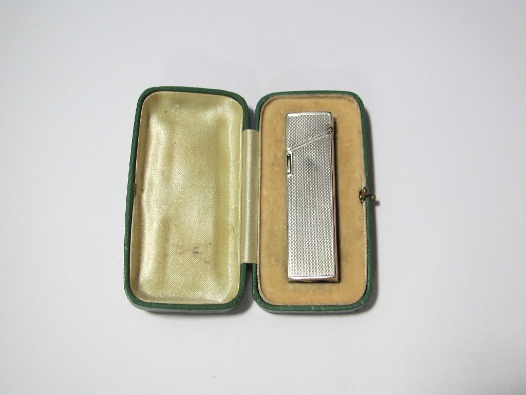 Appraisal: An Art Deco silver cigarette lighter engine engraved with press