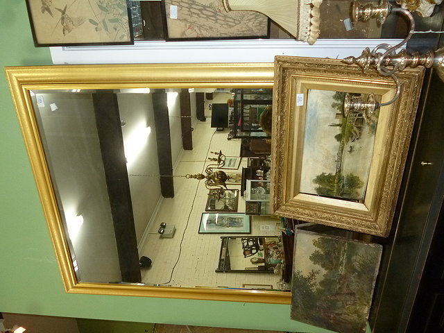 Appraisal: A LARGE RECTANGULAR GILT FRAMED MIRROR with bevelled plate cm