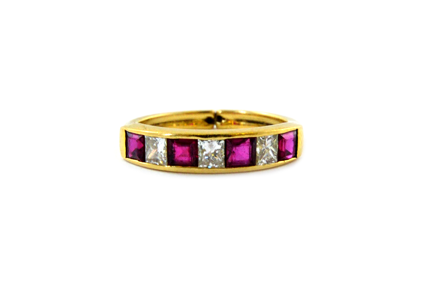 Appraisal: A modern ruby and diamond seven stone half-eternity ring the