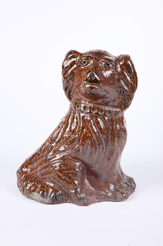 Appraisal: SEWERTILE FLAT HEAD DOG Ohio early th century Seated spaniel