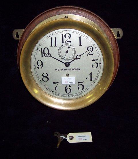 Appraisal: A US Shipping Board ship's circular brass chart-room clock with