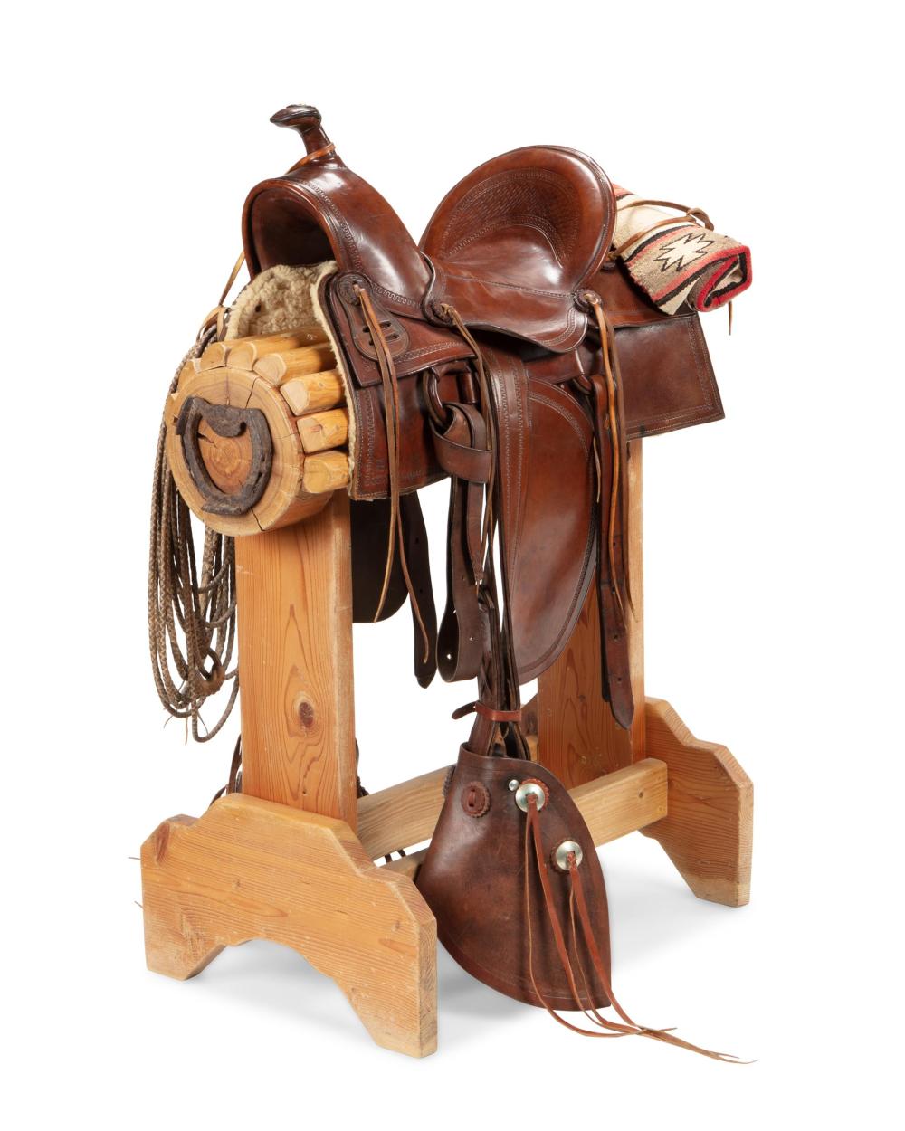 Appraisal: A Western roping saddle Circa s The tooled leather working