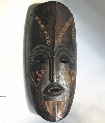 Appraisal: AN AFRICAN HAND CARVED MASK of elongated form incised and