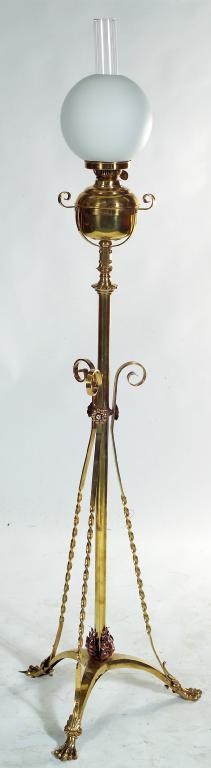 Appraisal: EDWARDIAN BRASS STANDARD OIL LAMP the tripod base with paw