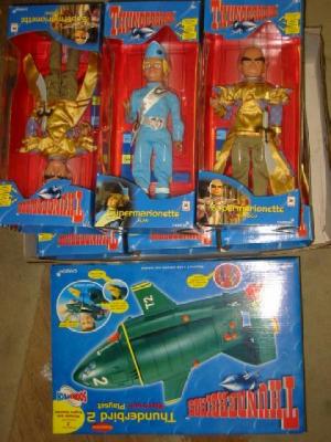 Appraisal: Six Thunderbirds Supermarionettes and a Thunderbird playset all boxed M