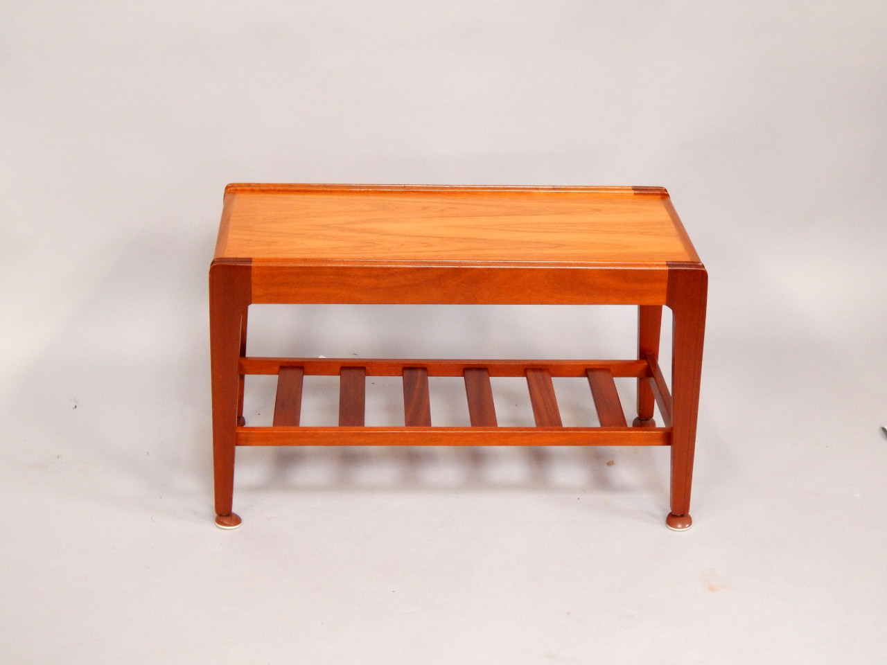 Appraisal: A Remploy teak occasional table of rectangular section raised on