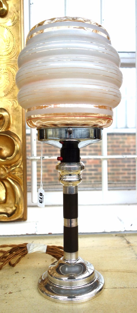 Appraisal: An Art Deco silver and bakelite mounted lamp hallmarked for