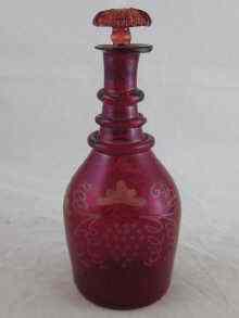 Appraisal: A continental th century small ruby glass carafe with stopper