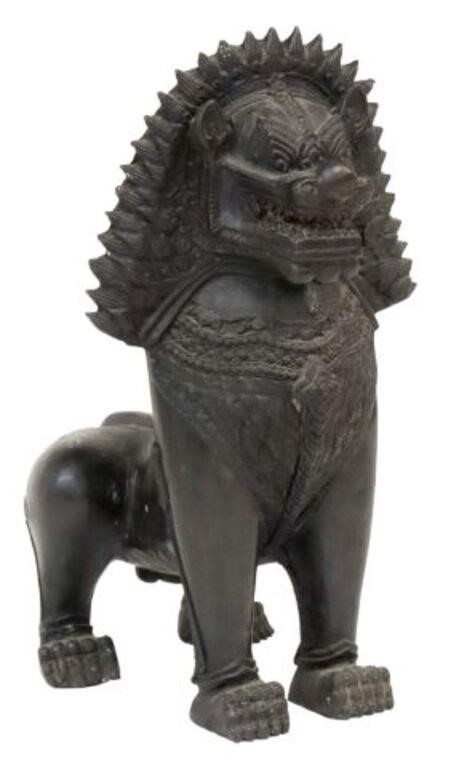 Appraisal: Asian patinated bronze foo lion sculpture lion bearing its teeth