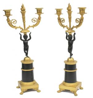 Appraisal: FRENCH EMPIRE STYLE GILT METAL PUTTI CANDELABRA pair French Empire