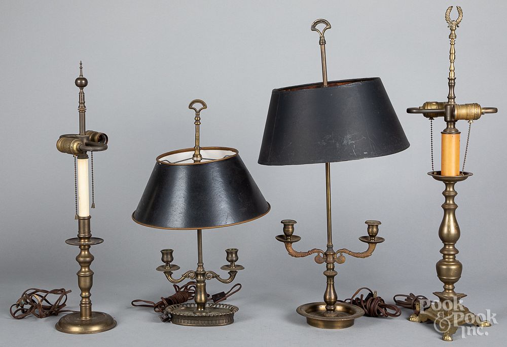 Appraisal: Four early brass table lamps Four early brass table lamps