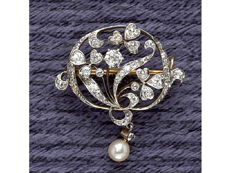 Appraisal: DIAMOND AND DANGLING PEARL BROOCH Platinum over yellow gold brooch