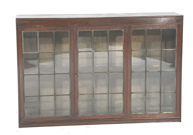 Appraisal: AN OAK DISPLAY CABINET enclosed by leaded panels high wide