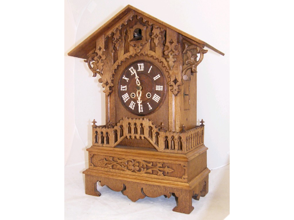 Appraisal: Large Black Forest pine two train mantel cuckoo clock with