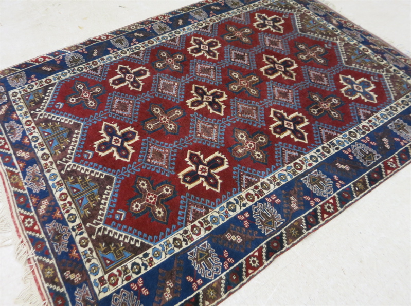 Appraisal: HAND KNOTTED TURKISH CARPET Turkoman geometric cruciform medallion and latch-hook