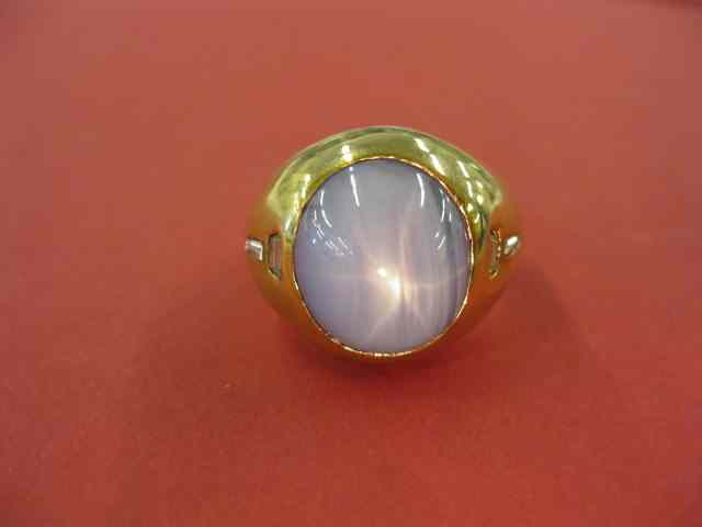 Appraisal: Star Sapphire Man's Ring carat blue-grey gem with trapeze baguette