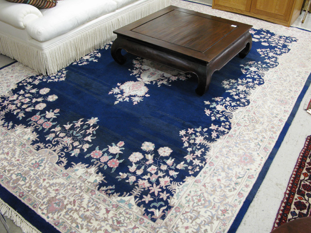 Appraisal: HAND KNOTTED ORIENTAL CARPET Persian Kerman design central floral medallion