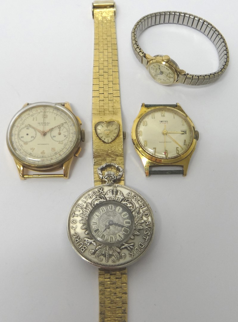 Appraisal: A gentleman's gold circular cased chronograph wristwatch the silvered dial