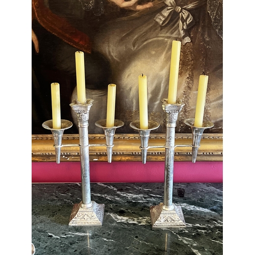 Appraisal: Pair of decorative silver metal three stick candle sticks