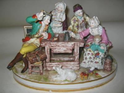 Appraisal: A DRESDEN PORCELAIN FIGURAL GROUP c modelled as a family