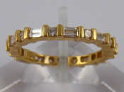 Appraisal: An carat gold round brilliant and baguette cut diamond eternity